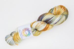 BFL-Silk Fine Lace-weight cream, dark blue and rust speckles