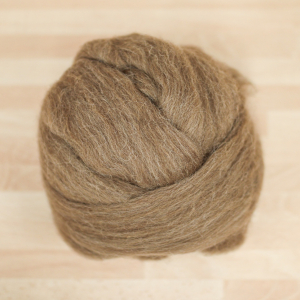 Natural brown Shetland wool tops, rolled into a ball