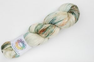 BFL-Silk Lace weight cream with dark green and rust speckles